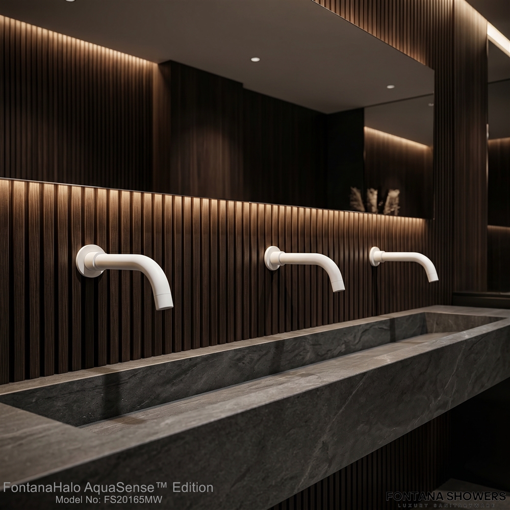 Private airport restroom with spa-inspired finish palette and faucet fixture coordination
